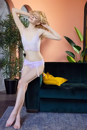 LinLin Seduces Barefoot On The Couch Teasing Every Curve